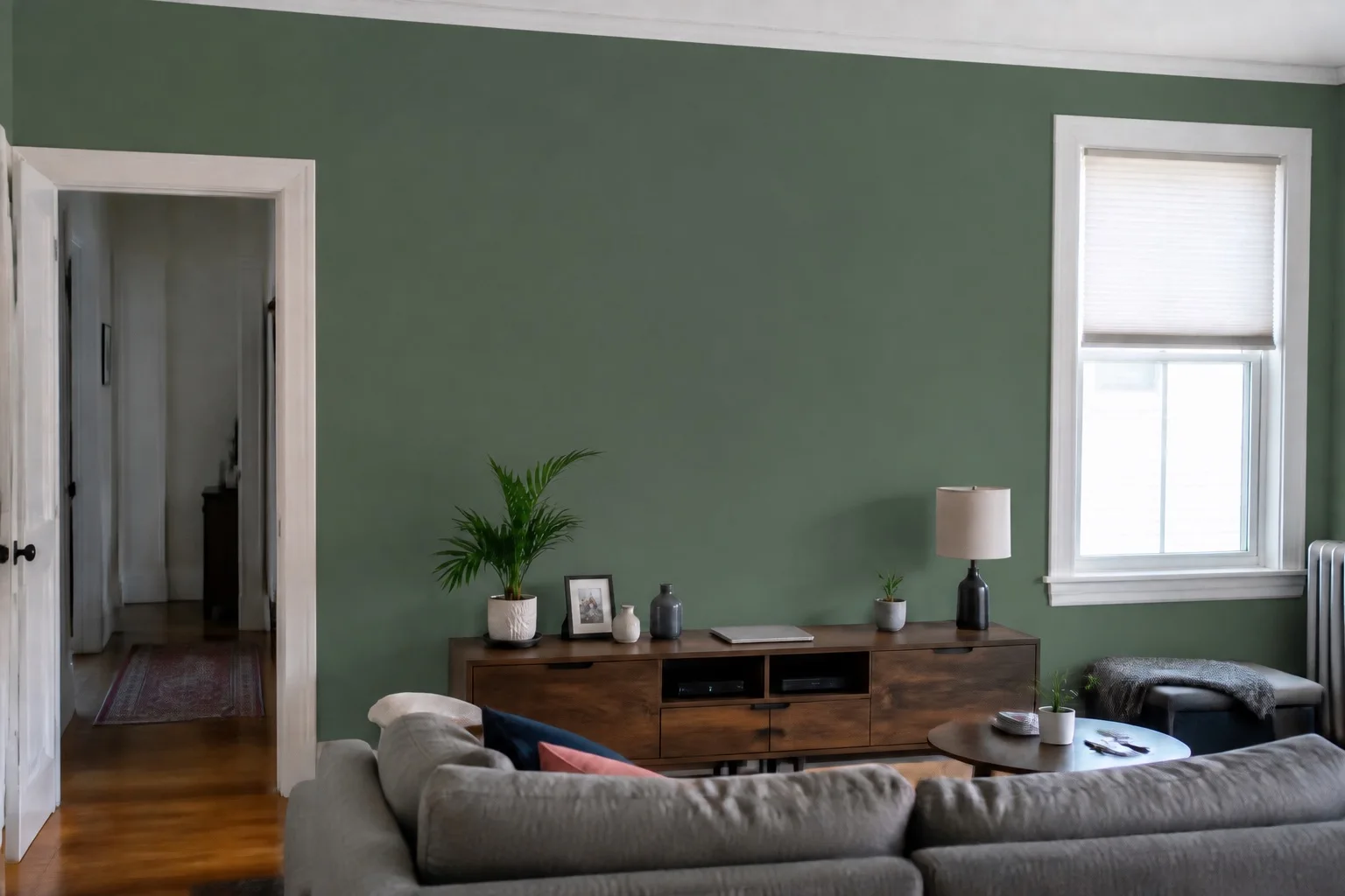 The same sample room with an illustrative sage-green wall preview